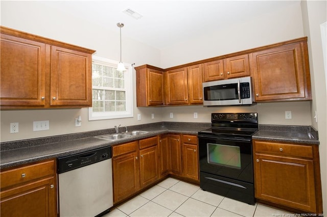 440 Moss Pink Dr, Vass, NC 28394 - kitchen with visible vents, dark countertops, a sink, and stainless steel appliances