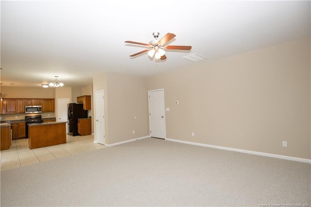 440 Moss Pink Dr, Vass, NC 28394 - unfurnished living room featuring baseboards, visible vents, ceiling fan with notable chandelier, and light colored carpet