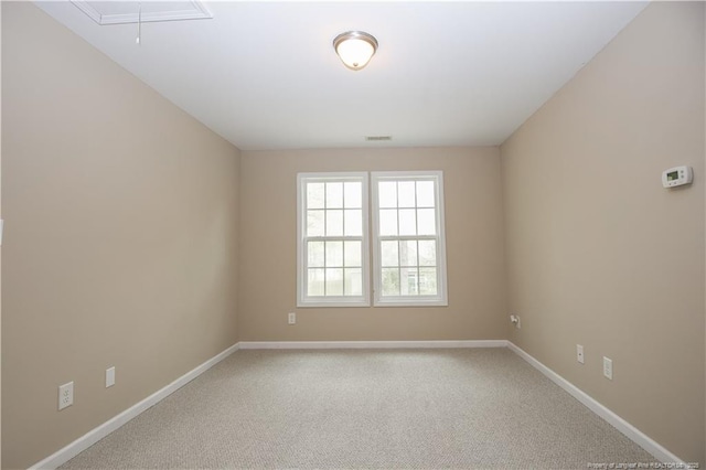 440 Moss Pink Dr, Vass, NC 28394 - unfurnished room featuring attic access, baseboards, visible vents, and carpet
