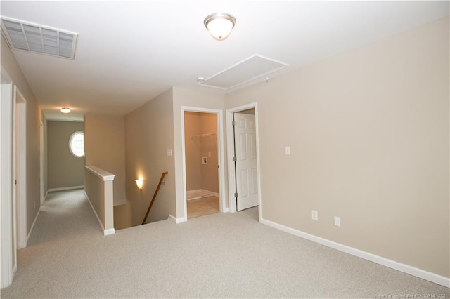 440 Moss Pink Dr, Vass, NC 28394 - spare room featuring baseboards, visible vents, attic access, and light colored carpet