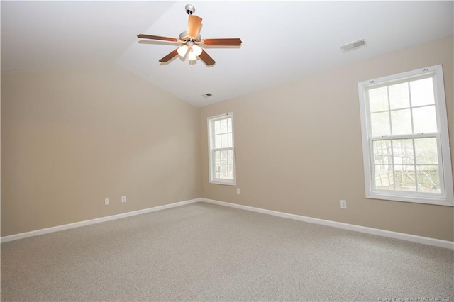 440 Moss Pink Dr, Vass, NC 28394 - unfurnished room featuring carpet flooring, lofted ceiling, baseboards, visible vents, and ceiling fan