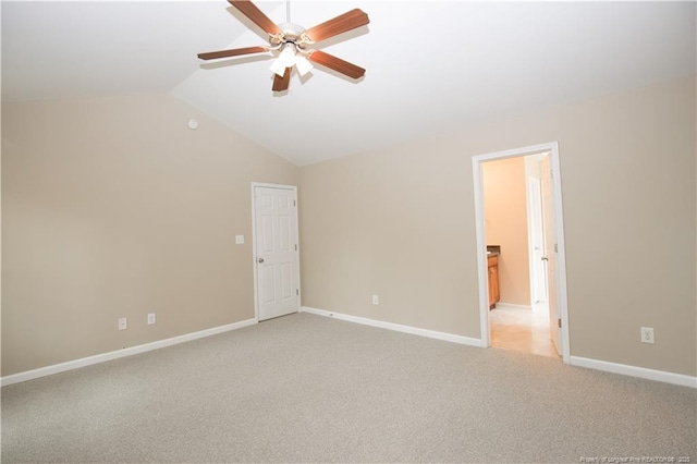 440 Moss Pink Dr, Vass, NC 28394 - empty room featuring light carpet, baseboards, vaulted ceiling, and ceiling fan