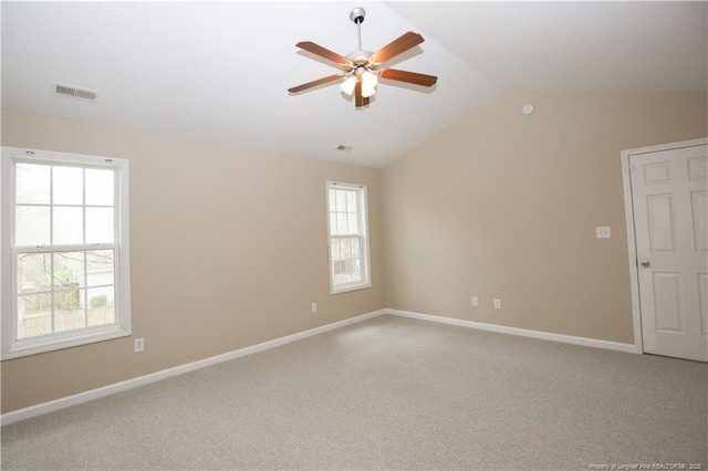 440 Moss Pink Dr, Vass, NC 28394 - carpeted empty room featuring ceiling fan, visible vents, vaulted ceiling, and plenty of natural light