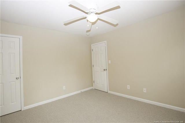 440 Moss Pink Dr, Vass, NC 28394 - empty room with baseboards, a ceiling fan, and light carpet