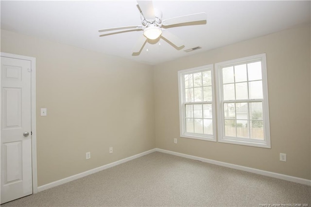 440 Moss Pink Dr, Vass, NC 28394 - empty room featuring light carpet, baseboards, visible vents, and a ceiling fan