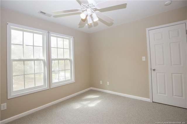440 Moss Pink Dr, Vass, NC 28394 - unfurnished room with carpet flooring, a ceiling fan, baseboards, and visible vents
