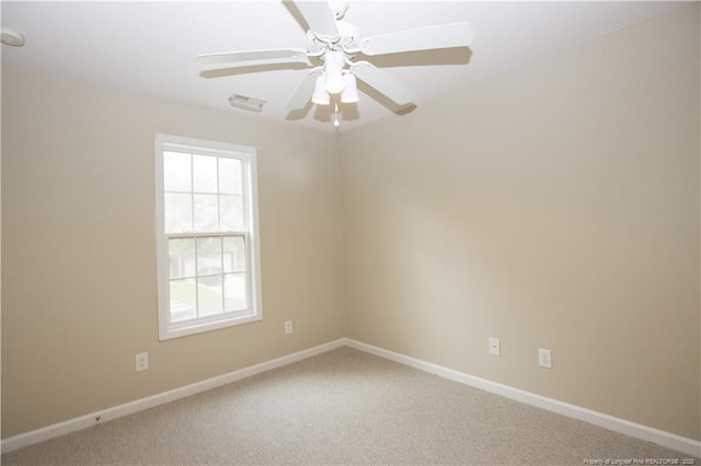 440 Moss Pink Dr, Vass, NC 28394 - carpeted spare room with baseboards, visible vents, and a ceiling fan