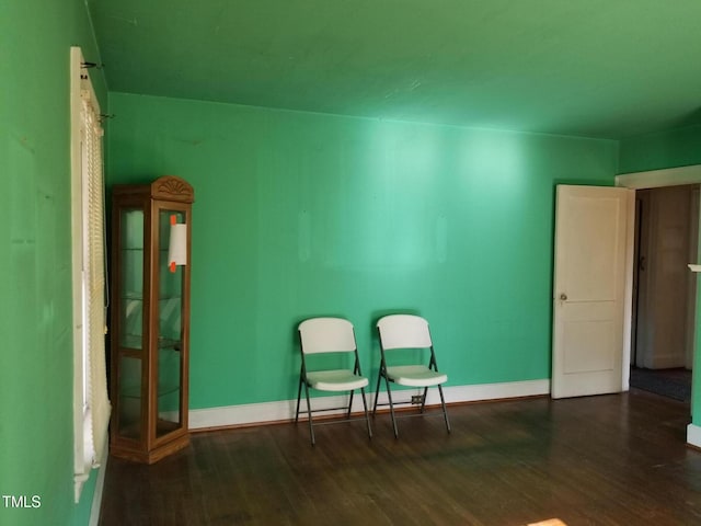 sitting room featuring wood finished floors and baseboards