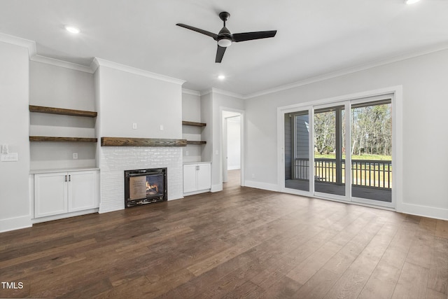 unfurnished living room with baseboards, crown molding, a ceiling fan, and dark wood-style flooring