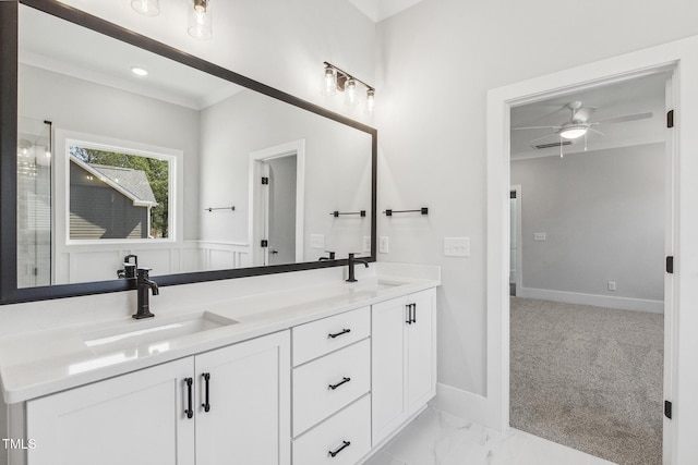 bathroom with ceiling fan, double vanity, marble finish floor, and a sink