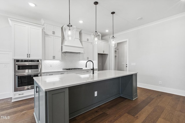 kitchen featuring stainless steel double oven, tasteful backsplash, dark wood-style floors, and premium range hood