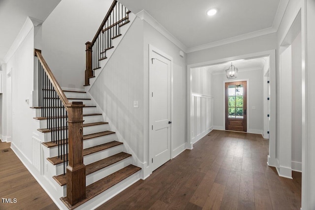 9004 Penny Rd, Raleigh, NC 27606 - entryway with stairway, ornamental molding, and dark wood finished floors