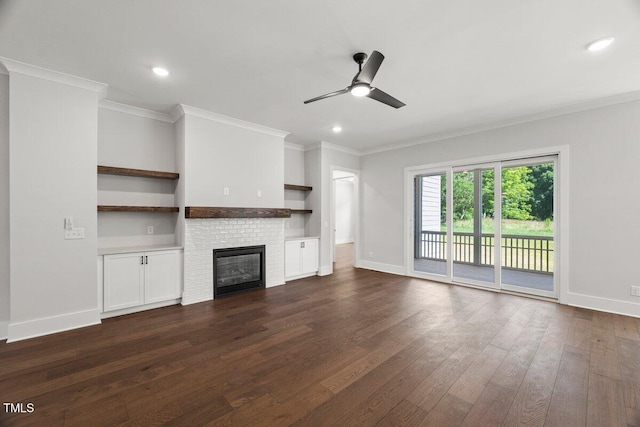 9004 Penny Rd, Raleigh, NC 27606 - unfurnished living room featuring a ceiling fan, dark wood finished floors, ornamental molding, a brick fireplace, and recessed lighting