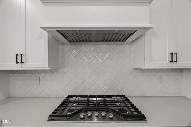 9004 Penny Rd, Raleigh, NC 27606 - kitchen with wall chimney range hood, white cabinetry, and tasteful backsplash