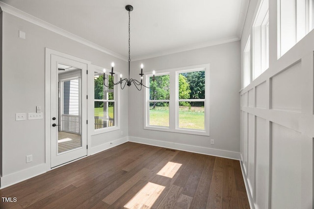 9004 Penny Rd, Raleigh, NC 27606 - unfurnished dining area with a chandelier, dark wood finished floors, and ornamental molding