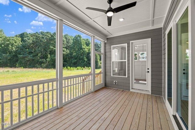 9004 Penny Rd, Raleigh, NC 27606 - unfurnished sunroom featuring ceiling fan and view of scattered trees