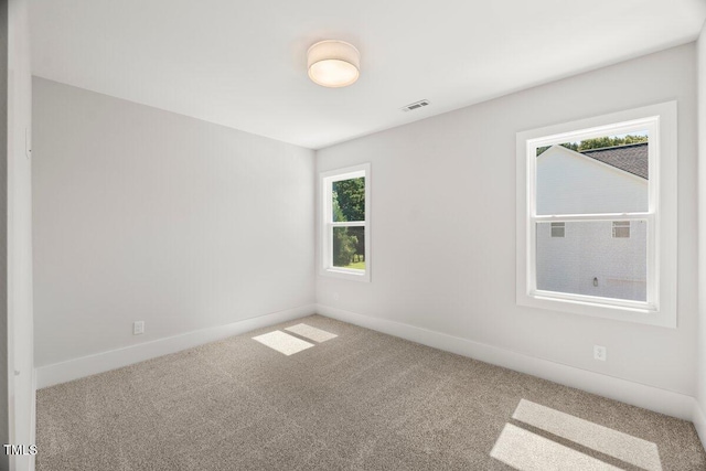 9004 Penny Rd, Raleigh, NC 27606 - carpeted spare room with baseboards