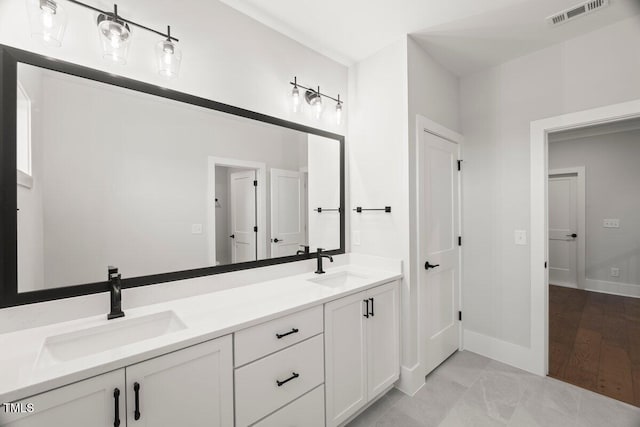9004 Penny Rd, Raleigh, NC 27606 - full bathroom with double vanity and baseboards