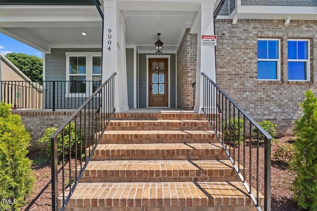 9004 Penny Rd, Raleigh, NC 27606 - doorway to property with brick siding and a porch