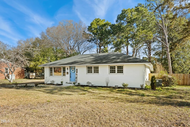 ranch-style home featuring a front yard and fence