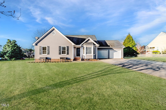 ranch-style home featuring a garage, a front yard, driveway, and fence