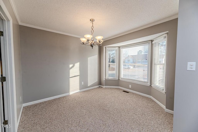 carpeted empty room featuring visible vents, baseboards, an inviting chandelier, a textured ceiling, and crown molding