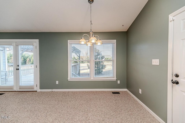 unfurnished dining area featuring visible vents, a healthy amount of sunlight, and carpet floors