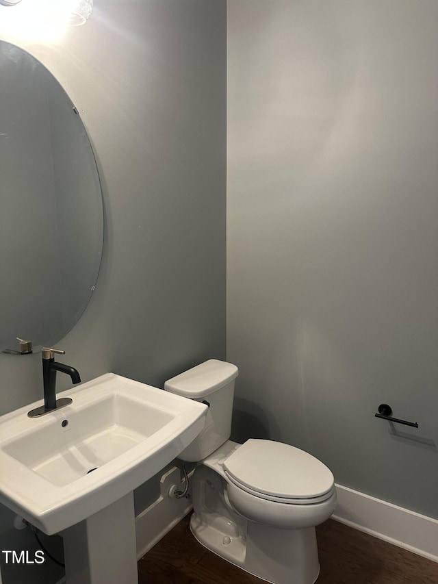 9000 Penny Rd, Raleigh, NC 27606 - half bath with toilet and wood finished floors