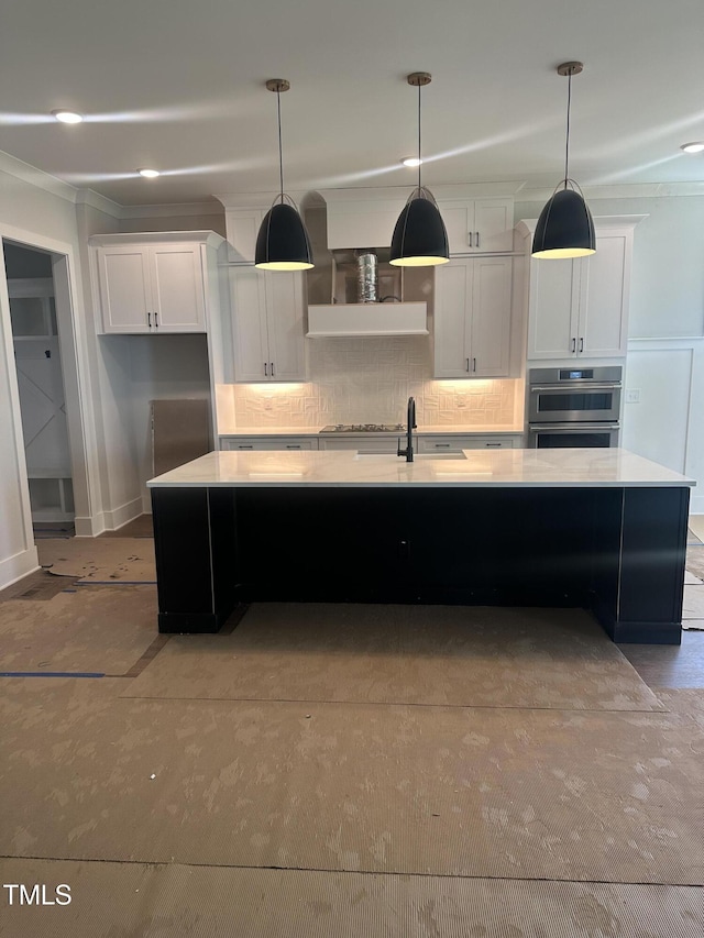 9000 Penny Rd, Raleigh, NC 27606 - kitchen with light countertops, a spacious island, backsplash, white cabinetry, and decorative light fixtures