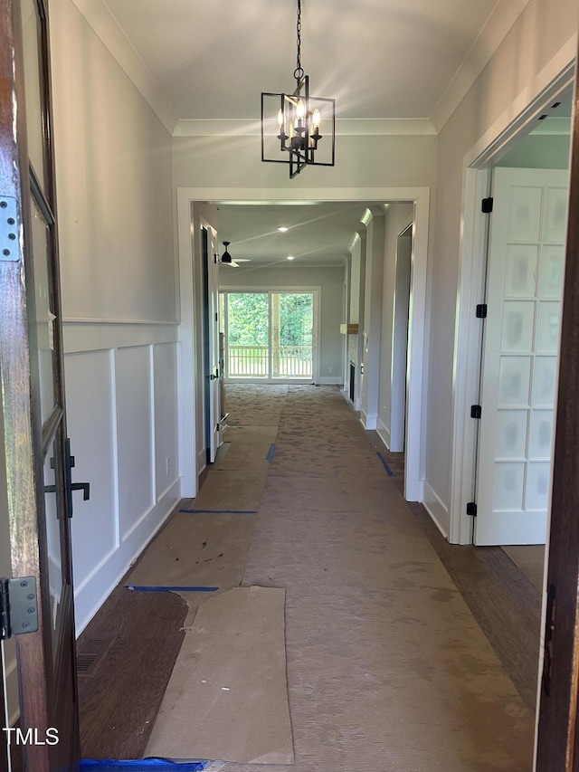 9000 Penny Rd, Raleigh, NC 27606 - corridor with crown molding and a chandelier