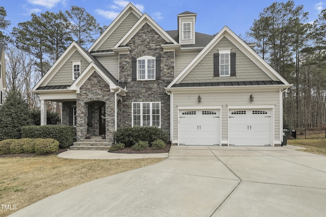 craftsman house with a standing seam roof, concrete driveway, and metal roof