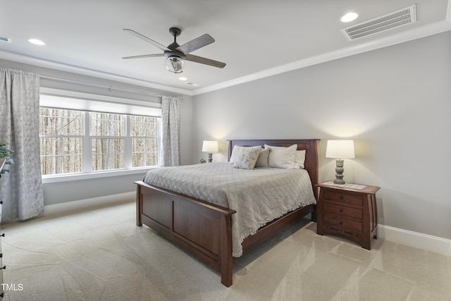 carpeted bedroom with visible vents, recessed lighting, baseboards, and ornamental molding