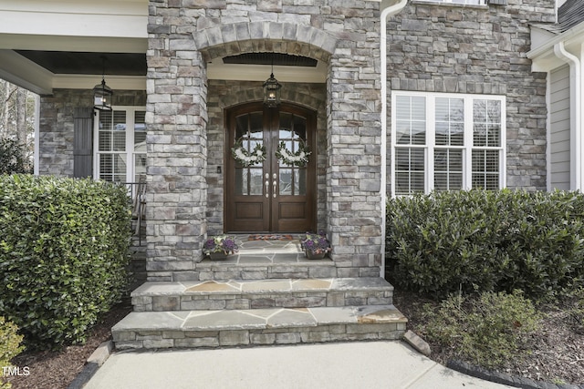 doorway to property with french doors and stone siding