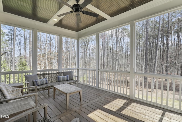 sunroom with plenty of natural light, coffered ceiling, and ceiling fan