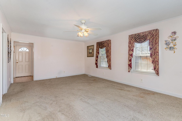 unfurnished room with carpet, baseboards, and ceiling fan