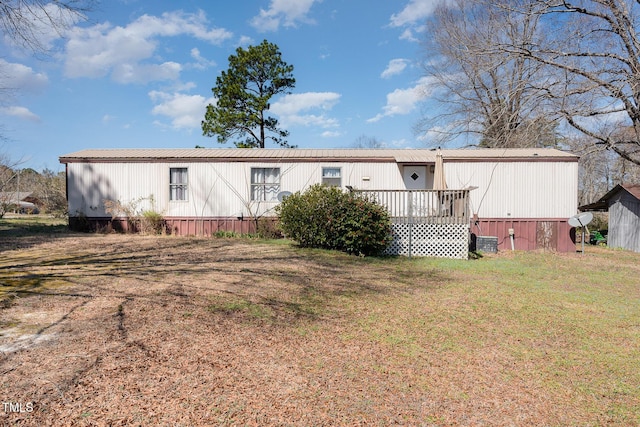 rear view of house with a lawn