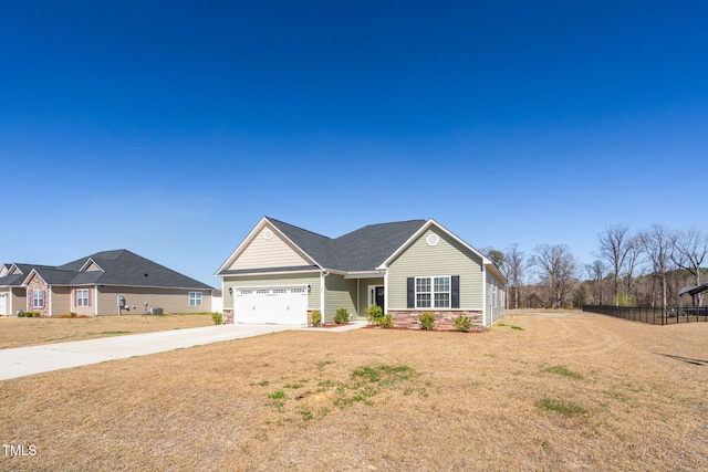 view of front of home featuring stone siding, an attached garage, concrete driveway, and a front lawn