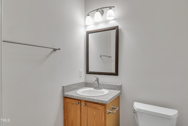 bathroom with toilet and vanity