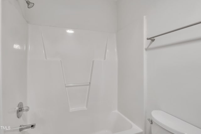 bathroom with shower / tub combination and toilet