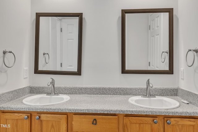 bathroom with double vanity and a sink