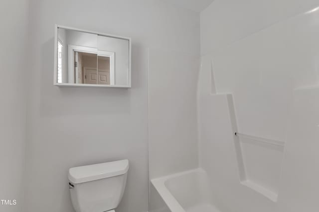 full bathroom featuring toilet, a bathing tub, and walk in shower