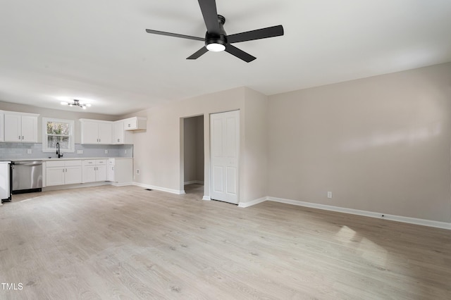 unfurnished living room featuring baseboards, light wood-style floors, and ceiling fan