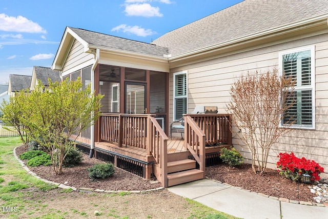 wooden deck with a sunroom