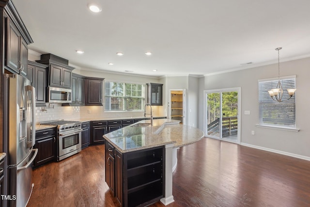 kitchen with dark wood-style floors, a sink, stainless steel appliances, crown molding, and backsplash