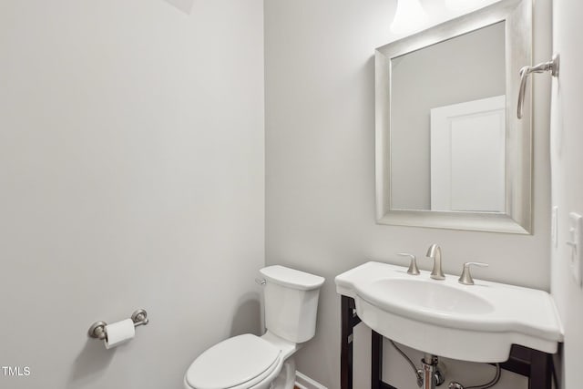 bathroom featuring toilet and a sink