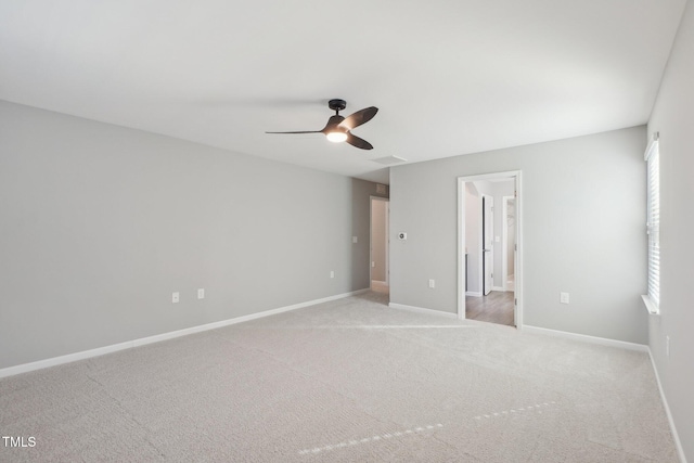 unfurnished bedroom featuring visible vents, baseboards, carpet floors, and ceiling fan