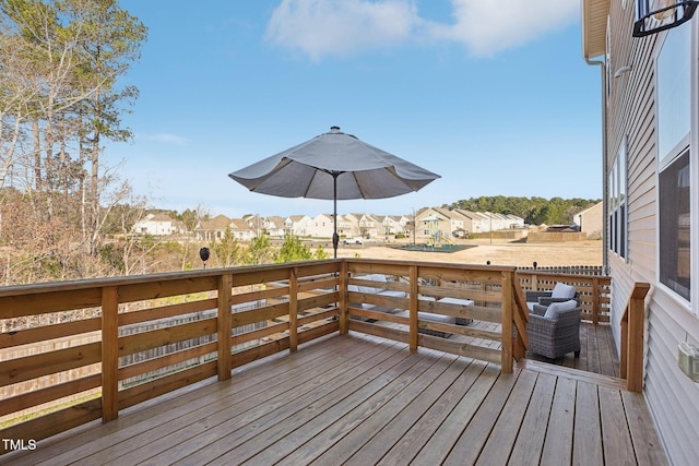 wooden deck with a residential view