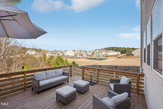 wooden terrace featuring a residential view and outdoor lounge area