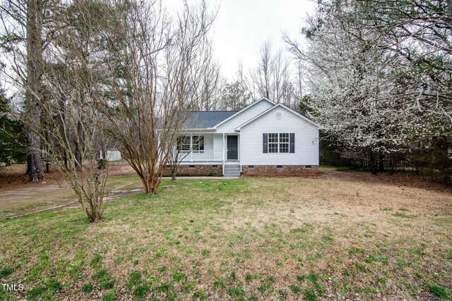 single story home featuring crawl space, a porch, and a front lawn