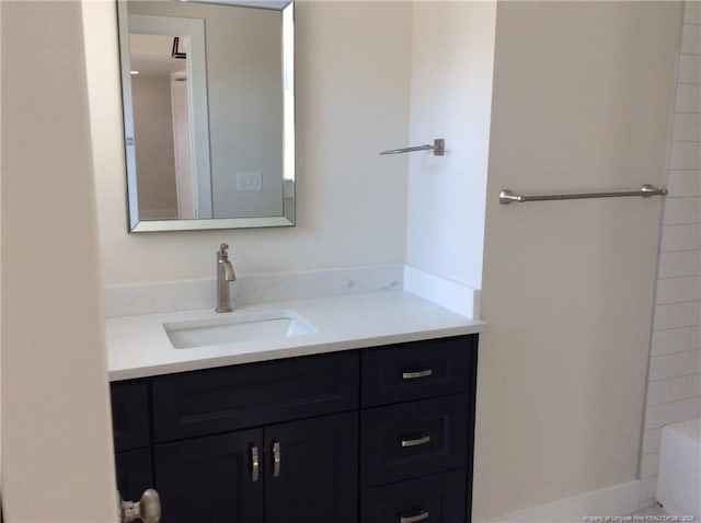 bathroom with a bathtub and vanity